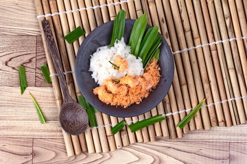 Sticky rice in coconut milk with stir-fried grated coconut and shrimp