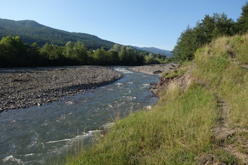 Fototapeta na wymiar River Shopurka. The mountain river in the Carpathian region. Transcarpathia