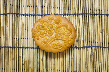 Mid-Autumn Festival moon cake on wooden traditional mat