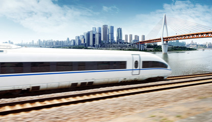 Fototapeta premium High-speed train through the modern city