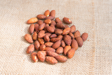 Almonds on sackcloth background