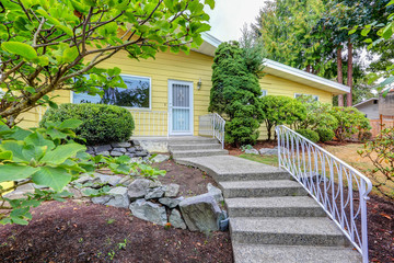 House exterior with yellow clapboard siding
