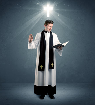 young priest in giving his blessing