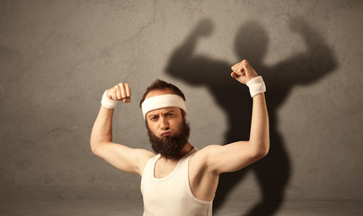 Skinny man with musculous shadow