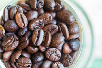 Coffee cup with beans, on white