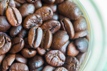 Coffee cup with beans, on white