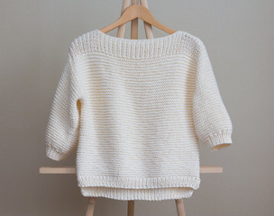 White sweater knitted manually