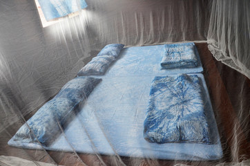 Bedroom and indigo sleeping set old style with bed nets in house