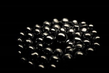 magnetic beads on a black background