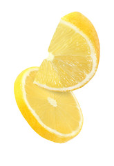 hanging, falling and flying piece of lemon fruits isolated on white background with clipping path