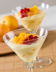 Custard and fruit dessert in a high glass