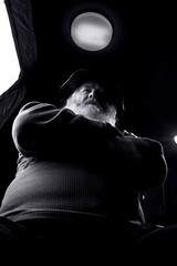 A man with a big, grey beard is sitting in the wheelchair