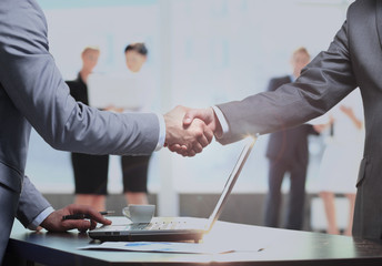 Business man shaking hand to partner