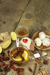 Natural treatment for colds and flu. Ginger lemon honey garlic and rosehip tea against influenza. Hot tea for colds. Home Pharmacy. Proven treatment of diseases. Folk medicine.
