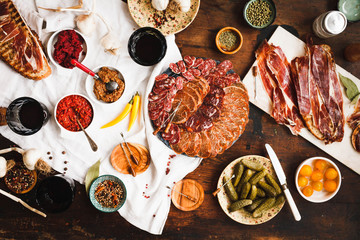Charcuterie and cured meat cutting board. Lomo, jamon, chorizo, salchichion, fuet and sausage cuts. 