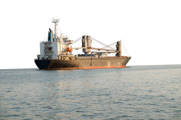 Cargo ship sailing in still water on white background