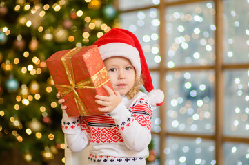Little girl with christmas gift box