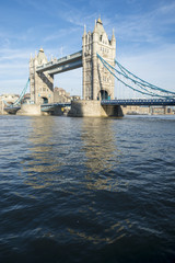 Fototapeta na wymiar Scenic landscape view of Tower Bridge standing tall in afternoon light above the River Thames as viewed from the South Bank in London, England