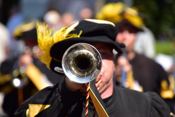 trumpet playing uniformed and marching musician