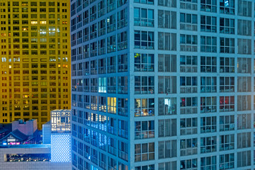 illuminated modern buildings at night in China.