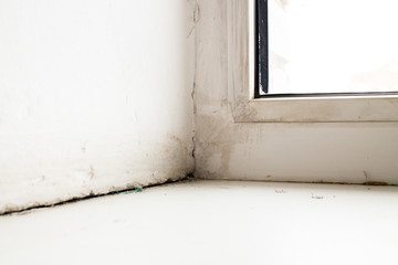 The crack between the sill window and the wall due to the deformation (shrinkage) of the house