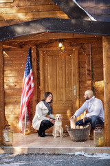 Male and female prepare firewood