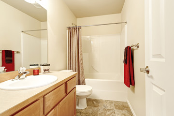 Bathroom interior in beige and brown colors.