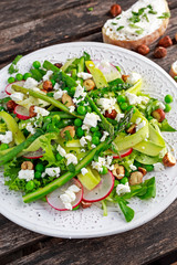 Fresh Green Asparagus salad witch Goat Cheese, peas, radishe, zucchini, lettuce and Hazelnuts.