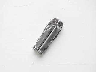 Multi-tool closed on white background