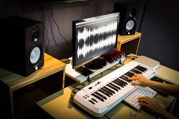 sound engineer, composer working in digital editing & recording studio for post production or...