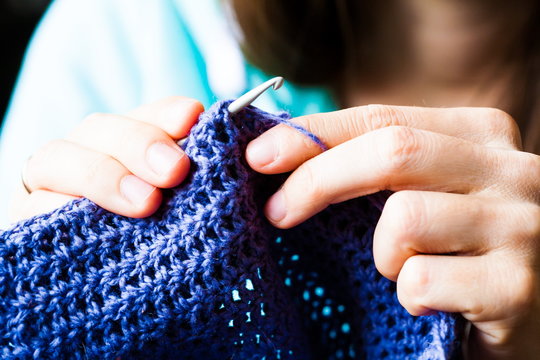 Knitting. Blue hat, hand knit, close up