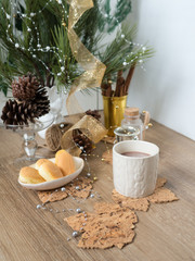 hot chocolate christmas pinecone butter bread wood background