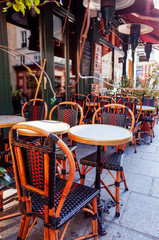 Street view of a coffee terrace with tables and chairs,paris Fra