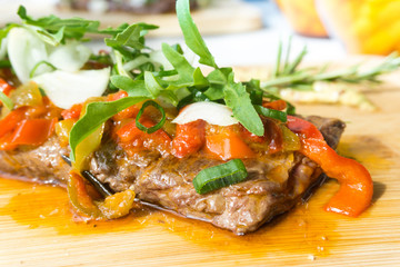 juicy steak beef meat with tomato and vegetables