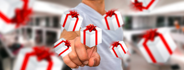 Man celebrating christmas holding gift in his hand