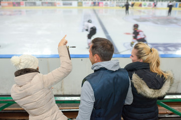 cheering a game of ice hockey - obrazy, fototapety, plakaty