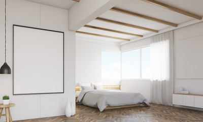 Corner of bedroom with two posters and window