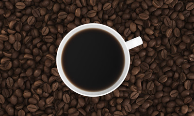 Top view of cup of coffee on its beans
