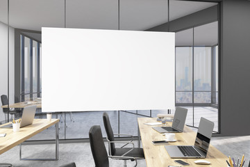 Horizontal poster in office with rows of tables and CEO study