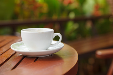 a cup of coffee and blurred bokeh background