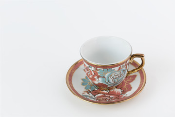Porcelain tea cup on white background