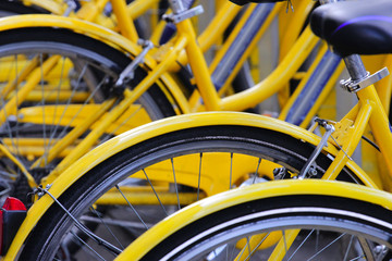 Fototapeta na wymiar yellow bikes parking