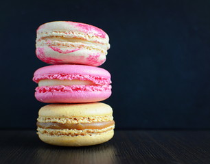 French colorful macarons with dark background
