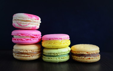 French colorful macarons with dark background