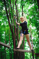 Hiking in the rope park beautiful sports girl