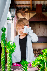  little girl talking on the phone. Child with mobile .  cute..