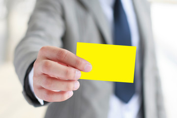 Businessman hand holding card