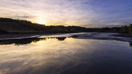 Reflection sunset over the pond