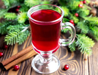 Glass cup with christmas hot punch for winter Cinnamon berrry wine Copy space