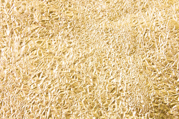 Gold wrinkled paper texture abstract background